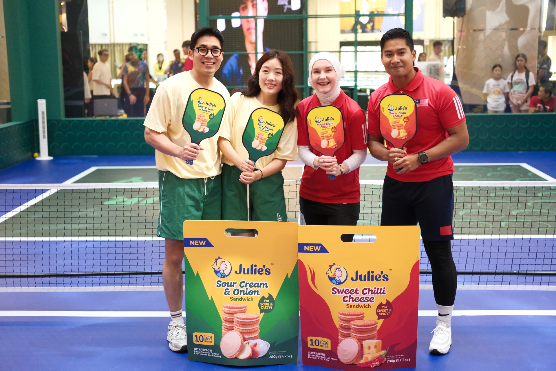 (From left to right) Content creators Abang & Seonma, and Alana & Abbas in a friendly
pickleball match at the Julie’s Sweet Chilli Cheese and Sour Cream & Onion Roadshow.