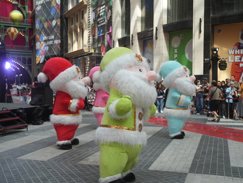 Santa Mascots Performing At High Street